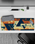 Intense 32x12 desk mat features warm tones and interlocking shapes with intricate details for fans of abstract art