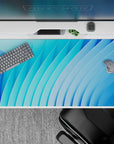 40x20 inches desk pad with minimalistic blue abstract curves, enhancing focus and productivity while creating a clean, refreshing desk setup.