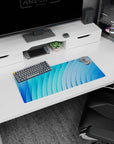 Minimalistic 28x12 inches mouse pad showcasing abstract blue curves, adding calm, focus, and modern elegance to your desk setup.