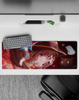 Megumin anime mouse pad, 32x12 inches, featuring her wild grin and sparkling crimson eyes, with Chomusuke floating beside her.