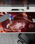Megumin anime desk pad 40x20 inches, featuring her wild grin, crimson eyes, and Chomusuke, with vibrant magic effects.