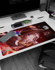 Megumin anime desk pad 40x20 inches featuring her grin, crimson eyes, and Chomusuke amid colorful magic explosion.