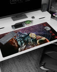Edward Elric raises his glove as Alphonse looms behind in armor on a 40x20 inches anime desk pad.