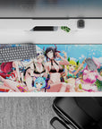 36x16 inches bright pool party anime desk pad in blue, black, red, white, lime, and pink hair tones.