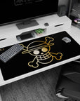 Large 40x20 inches desk pad featuring the Straw Hat Pirates' golden Jolly Roger from One Piece, exuding minimalism and adventure in a striking design.
