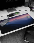 Serene 40x20 anime desk mat with a twilight glow, featuring mountains, soft purples, blues, and a pink horizon for a calming effect