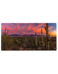 Mouse pad featuring desert sunset, 32x16 inches, with pink and orange skies and towering cacti for a Southwest-inspired workspace look.