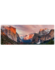 Compact 32x12 inches mouse pad with mountain landscape design, featuring sun-kissed cliffs, snow-capped peaks, and a stunning waterfall for an outdoor aesthetic.