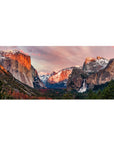 Mouse pad featuring mountain landscape design, 36x16 inches, with sun-kissed cliffs, snow-capped peaks, and a stunning waterfall for a peaceful outdoor effect.