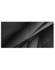 Mouse pad featuring abstract geometric layers in rich black and gray tones, 32x16 inches, perfect for a minimalist and futuristic desk setup.