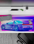 36x16 inches desk pad with the Neon Racer Drift, capturing the spirit of retro racing with neon lights and a sleek sports car in a vibrant sunset.