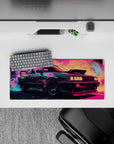 Compact 28x12 mouse pad highlights retro racing vibes with vibrant neon colors and retrofuturistic art