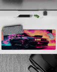 Nostalgic 32x12 mouse pad features bold neon colors and retro car design for fans of retrowave aesthetics