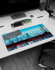 Modern 32x16 inches mouse pad featuring Asuka Langley Soryu, with cyberpunk cityscape, electric blues, and industrial elements for an intense anime aesthetic.