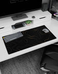 Modern 32x16 inches mouse pad showcasing sleek gold lines over a black background, perfect for a stylish and functional desk setup.