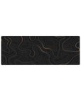Compact 32x12 inches mouse pad featuring elegant topographic lines in a subtle gold gradient over black, ideal for adding modern refinement to smaller desks.