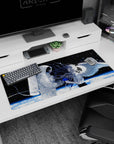 Astronaut reaches for winged anime girl with flowing silver hair on a 36x16 inches desk pad.