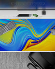 40x20 inches desk pad showcasing abstract sunset liquid waves with vibrant blue and golden yellow, ideal for transforming your desk with colorful, fluid artwork.