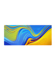 Mouse pad featuring swirling liquid wave patterns in vivid blue and golden yellow, 28x12 inches, perfect for adding dynamic energy to your workspace.