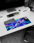 Purple-haired anime girl lounging with arms up on mouse pad 28x12 inches, teal bikini, cosmic sea.