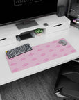Artistic 32x12 inches mouse pad showcasing Akatsuki clouds in pink, adding a playful yet dangerous touch to your workspace.