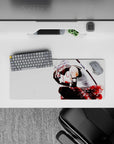 28x12 inches anime desk mat in silky blacks with vivid red accents, clean backdrop, and soft floral mood.