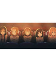 Anime girl desk pad 36x16 inches with five teary-eyed girls in matching tees under cinema lights.