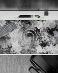 40x20 inches desk pad showcasing monochrome liquid swirl designs with hypnotic black-and-white patterns, blending artistic chaos with modern elegance.