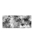 Mouse pad featuring swirling black-and-white liquid waves, 28x12 inches, perfect for adding modern elegance and artistic flair to your workspace.