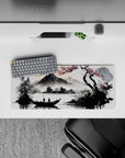 Compact 28x12 desk mat highlights cherry blossoms and serene waters for immersive tranquil vibes