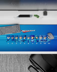 Blue gradient anime desk pad with nostalgic retro energy and collector style, 36x16 inches.