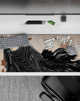 36x16 inches desk pad with Guts, the Black Swordsman, featuring his flowing cloak and battle-ready sword, perfect for bringing intensity and passion to your workspace.