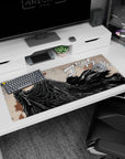 Artistic 36x16 inches desk pad showcasing Guts from Berserk, with his iconic dark cloak and giant sword, ideal for adding raw intensity and power to your workspace.