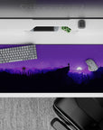 Serenity 36x16 desk pad featuring a starry night sky, purple-hued mountains, and trees for a peaceful outdoor experience