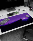 Serene 40x20 anime desk mat showcasing a moonlit wilderness with purple-hued mountains, trees, and a starry night sky for a calming atmosphere