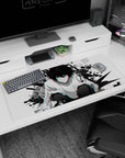 36x16 inches Death Note desk pad featuring L crouched low with piercing stare, spiky black hair, white shirt.