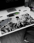 Large 40x20 inches desk pad featuring the dark world of Berserk with the Black Sun and nightmarish demons, ideal for fans seeking an intense, iconic desk setup.