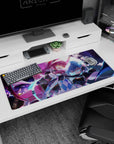 36x16 inches anime girl desk pad showing pink-haired girl with yellow glasses and blue-haired partner in top hat.