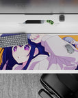 Bright orange anime desk pad 36x16 inches with navy hair, starry purple eyes, playful cheeky vibe.