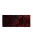 Mouse pad featuring bold abstract crimson designs with black tangled patterns, 28x12 inches, perfect for adding striking intensity to your workspace.