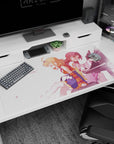 Anime girl desk pad 40x20 inches showing peach-haired girl with braid beside crimson-haired pianist on bench.