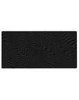 Mouse pad featuring black wavy pattern design, 32x16 inches, with monochrome flowing lines for a sleek, calming vibe in your workspace.