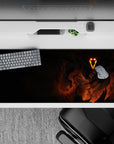 Mysterious 36x16 desk pad featuring fiery figure in shadows for bold and striking desk decor