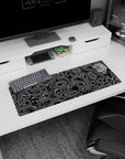 Small but impactful 32x12 desk mat showcases bold black-and-white artistry with striking movement and flow