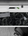 36x16 inches desk pad with minimalist black and white contour lines, blending modern elegance with organic flow for a stylish workspace.