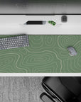 36x16 inches desk pad with flowing topographic designs on a sage green background, blending modern style with serene, nature-inspired elegance for your workspace.