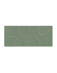 Mouse pad featuring sage green tones and flowing topographic lines, 28x12 inches, perfect for bringing peaceful, modern aesthetics to your workspace.