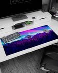 Vivid 36x16 anime desk mat showcasing a firewatch tower and twilight sky with vibrant pink, purple, and blue hues for an adventurous atmosphere