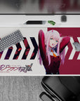 40x20 inches desk pad with Zero Two from Darling in the Franxx, showcasing her fierce energy and dynamic pose in vibrant colors.