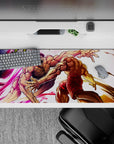 Neon pink slash trails and warm gold impact sparks on an anime desk pad 36x16 inches, high-energy.